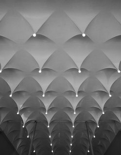 Ode to a Forward-Thinking America: Columbus, Indiana - Photo 11 of 18 - From 1964 to 1965, Alexander Girard designed the interiors of the Cummins Corporate Office. For the lobby's ceiling, Girard worked with Cummins project manager Harold Hatter to fabricate the plaster-coated metal "stalactites.""