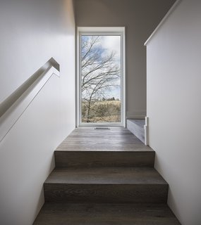 An Artist and Farmer Work With a Toronto-Based Studio to Build a Barn-Inspired Home - Photo 6 of 11 - The flooring and stair treads are by Northern Wide Plank. 