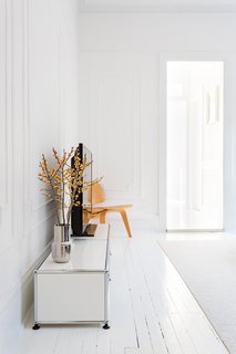 A Pair of Designers Renovate Their Brooklyn Brownstone With a Bright Monochromatic Palette - Photo 5 of 12 - "When everything is painted white, you can really feel the spatial flow and the sectional geometry, which is interesting because it goes from being a rectangle to a square," Ed notes.