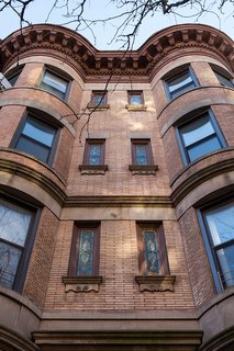 A Pair of Designers Renovate Their Brooklyn Brownstone With a Bright Monochromatic Palette - Photo 11 of 12 - Stained-glass windows mark the facade of the Park Slope building. 
