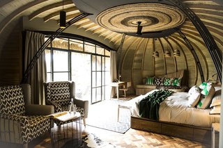 Take an Eco-Escape to a Spherical Forest Villa in an Eroded Volcanic Cone in Rwanda - Photo 3 of 10 - Caline Williams-Wynn, her team from Artichoke, and Teta Isibo worked together on the interiors, which include colorful textiles and tons of texture.