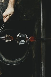 Master Glassmaker Simon Pearce's Sustainable Factory in Vermont - Photo 12 of 16 - Marrying Base And Cup The cup and base are then reheated to the same temperature and joined. 