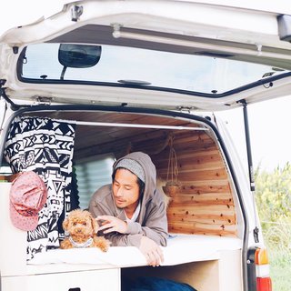 9 Adventure Seekers Who Celebrate Small Space Living Through the Van Life - Photo 2 of 10 - A Japanese couple and their fluffy pooch Roy are traversing the heartland of Japan in their stylish, wood-paneled abode.