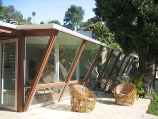 Experience L.A. Like an A-Lister at One of These Modern Short-Term Rentals - Photo 10 of 11 - This midcentury-modern home in the Hollywood Hills was recently treated to a renovation. Large windows provide for bright and airy interiors with stunning views, while the large patio is the perfect place to enjoy watching the sunset. To complete your southern California experience, the terraced yard has lemon, grapefruit, and avocado trees.