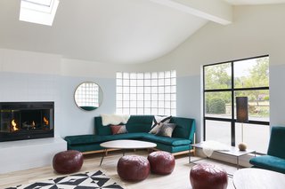 A Napa Valley Motor Lodge Reinterprets the Classic Roadside Motel - Photo 1 of 8 - The lobby, anchored by a pair of green velvet sofas and a fireplace, combines a lounge area and general store with beverages and snacks; games to play by the pool, in the room, or on the road; and a curated selection of retail goods.