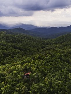 A Rustic-Modern Cabin Inspired by Japanese Bungalows and Shou Sugi Ban - Photo 5 of 12 - On weekends, architect Michael Neiswander and his partner, Nick Corsello, leave their Atlanta loft and drive to their Scaly Mountain retreat to be immersed in nature. 
