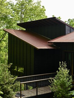 A Rustic-Modern Cabin Inspired by Japanese Bungalows and Shou Sugi Ban - Photo 9 of 12 - Like the entry bridge (below), the deck is surrounded by welded-wire fencing made by West Macon Welding. 
