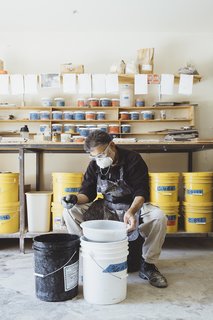 Go Behind the Scenes With a Process-Driven Handmade-Tile Company in California - Photo 2 of 13 - Senior glaze technician Mushtaque Khan sifts particles at the company’s factory near Salinas. All tiles at Fireclay are made to order by hand. The firm creates its own lead-free glazes in more than a hundred colors, along with custom shades. "We have trouble saying no to color," says founder and chief ceramicist Paul Burns. 