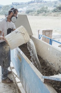 Go Behind the Scenes With a Process-Driven Handmade-Tile Company in California - Photo 5 of 13 - Adding Water: Water recaptured from a later phase in the process and then filtered for reuse is blended with the dry ingredients in a mixer for 30 minutes. Batches range from 1,100 to 1,700 pounds.