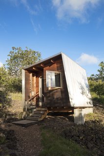 Two Tiny Pavilions Respectfully Perch Atop a Lava Flow on Maui - Photo 1 of 8 - Clad in western red cedar, a studio called Mauka, Hawaiian for "inland toward the mountains," anchors a getaway in Maui that architect Erin Moore designed to honor the owner’s connection to the land.<br>