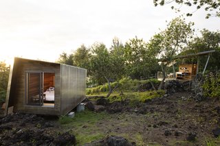 Two Tiny Pavilions Respectfully Perch Atop a Lava Flow on Maui - Photo 2 of 8 - Moore worked with contractor David Sharp to ensure that the pavilions, each measuring under 120 square feet, would sit lightly on the sloping site. "A big structure would have been about the house, and not the place," she says. "Having multiple units was important."
