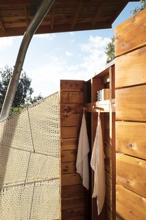 Two Tiny Pavilions Respectfully Perch Atop a Lava Flow on Maui - Photo 6 of 8 - The open-air shower features a screen Moore wove from marine rope. 