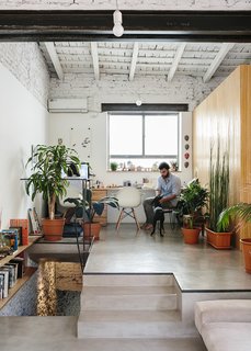 An Architect Turns His Small, Dark Apartment in Buenos Aires Into a Bright and Airy Home - Photo 2 of 10 - Architect Hernán Landolfo and his girlfriend, photographer Lucia Gentile, live and work in the apartment, sharing an elevated office space.