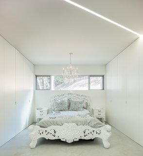 The Conversation Pit Makes a Much-Appreciated Comeback at an Ultramodern Home in Cupertino - Photo 8 of 9 - Ornate furnishings in the bedrooms offer an intriguing contrast to the rest of the house.