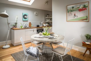 9 Traditional-Turned-Modern Cottages You Can Rent in the UK - Photo 5 of 9 - Set within the Brecon Beacons National Park in Wales, Faraway House consists of two old stone dwellings that have been renovated and decorated with colorful, patterned fabrics and vintage travel posters.