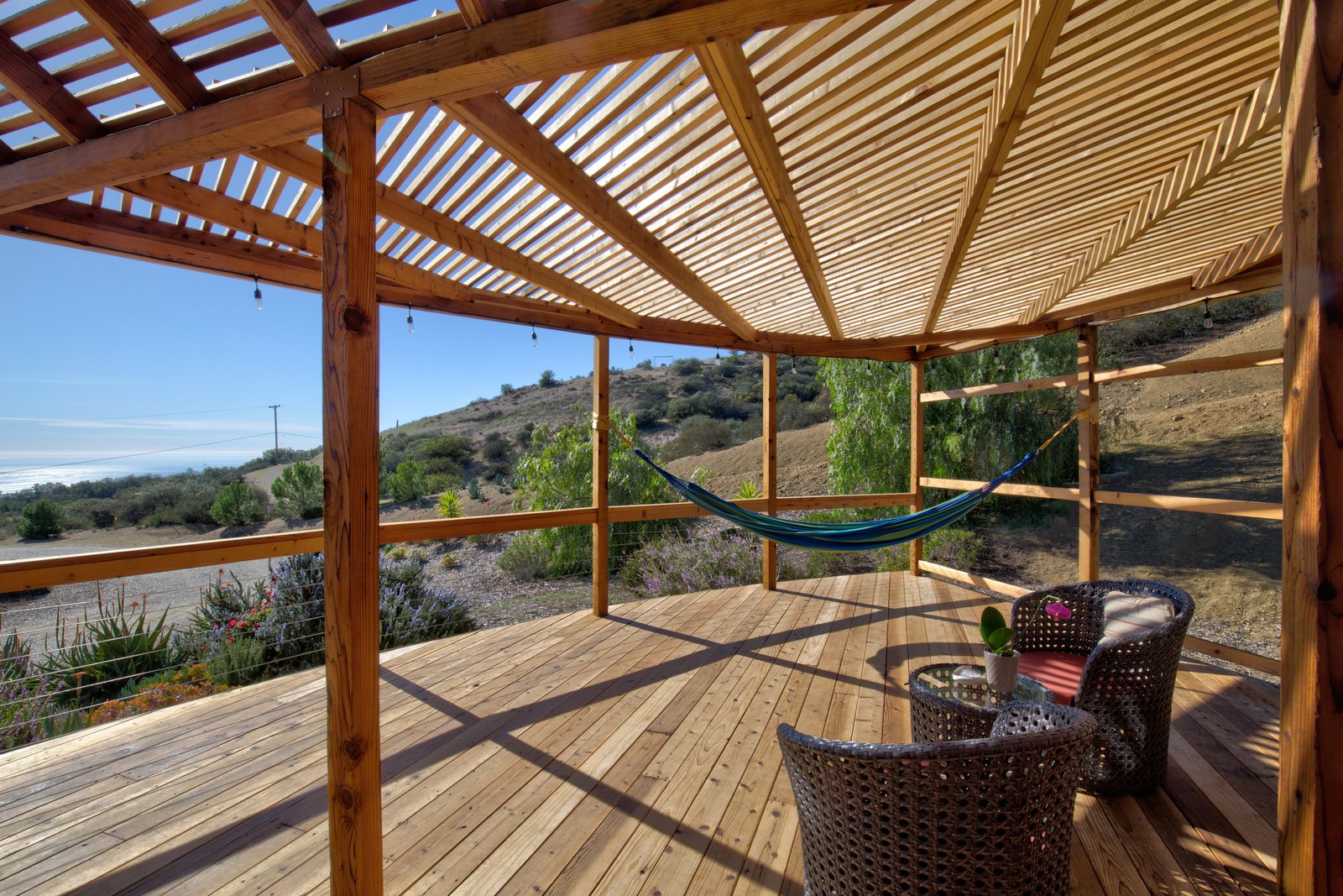 The deck has multiple lounge spaces, including two hammocks, and would make for an inspiring, open-air yoga studio.