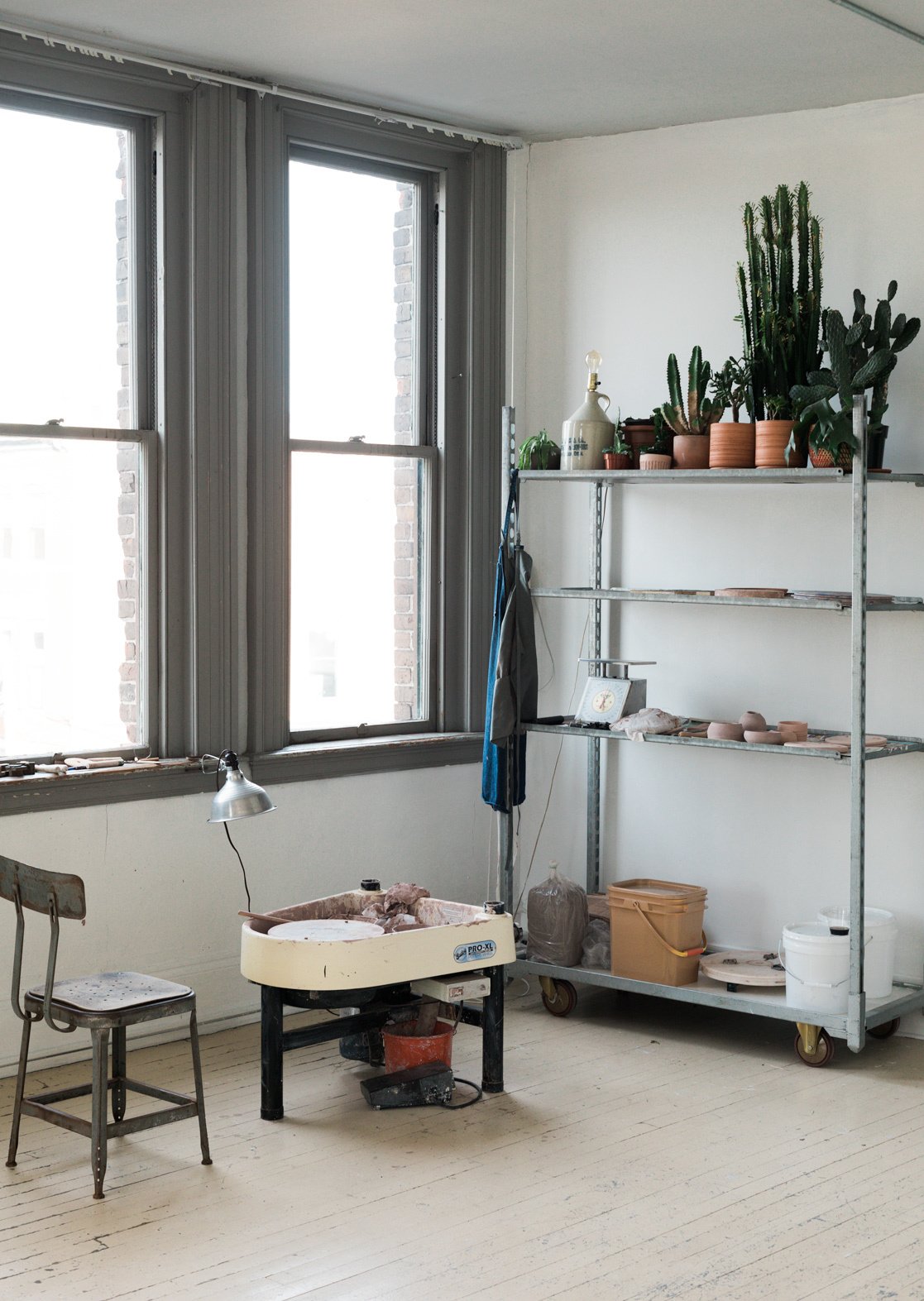 In one corner of the studio, Spellman has an area dedicated to ceramics, as pictured above.