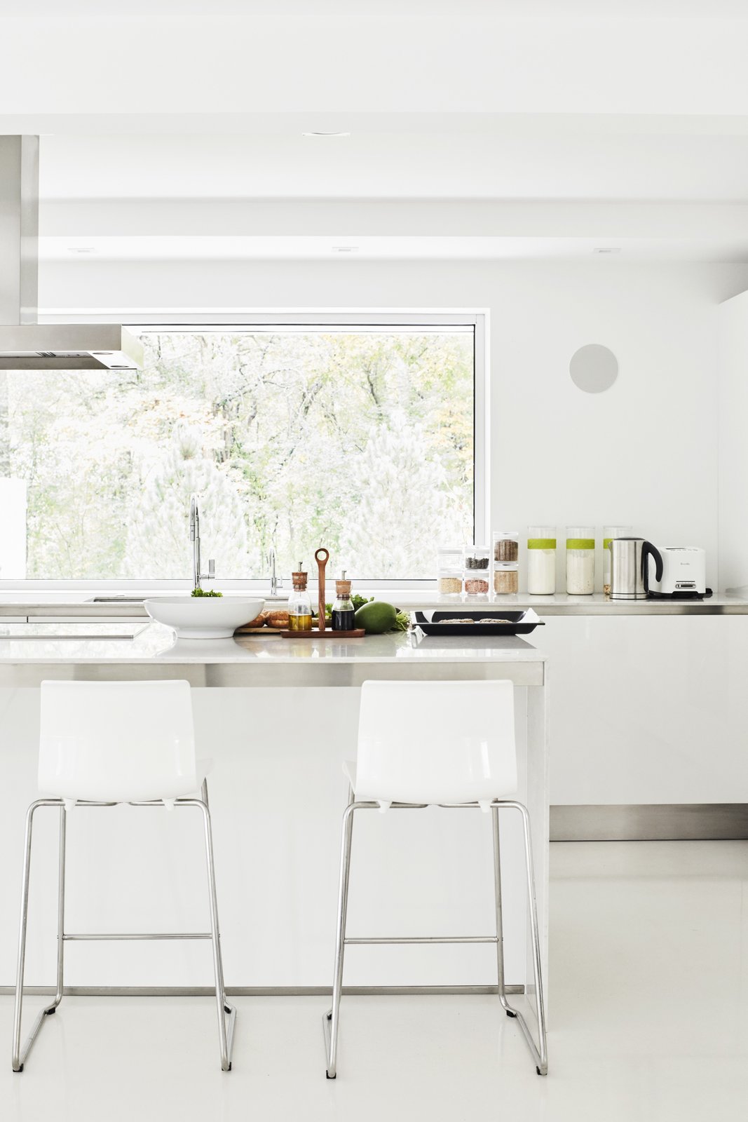 For convenience, Eva and restoration architect Victor Drapszo moved the kitchen from the second floor to the first floor, which originally housed a garage, laundry, and guest room. The cabinetry is Gamma by Arclinea, the countertops are Lagoon quartz by Silestone, and the floor is polished concrete.