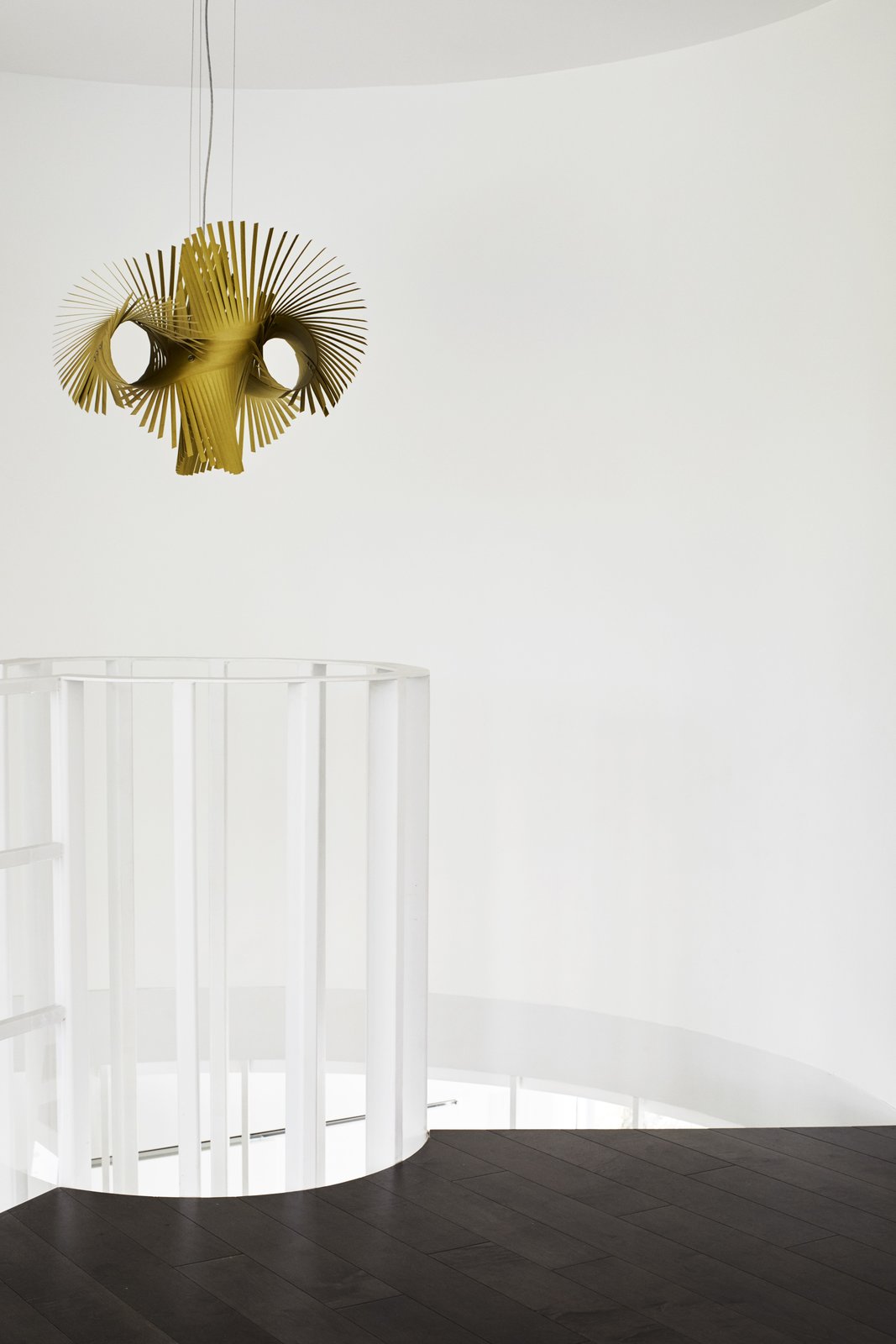 A Minimikado light from Lzf Lamps hangs at the top of the staircase.
