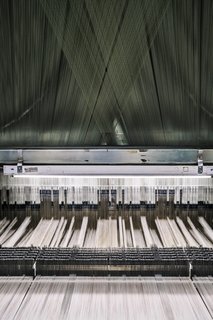 From Sketchbook to Loom, We Reveal How a Brooklyn Designer Created Her New Ocean-Inspired Textile - Photo 22 of 26 - <b>6 Prepare the Loom</b> The Tidal Wave pattern is woven using a Jacquard loom, a machine that dates to 1804. Today, MTL uses a computer file that acts as the loom’s "brain" and controls the binary weaving process. 