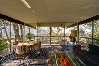 Live Like Steve McQueen for a Cool 2.5 Million Dollars - Photo 3 of 6 - Enjoy sweeping vistas of the San Jacinto Mountain range and downtown Palm Springs just like Steve did. While you're at it, try contemplating the pattern of the rug by Edward Fields, if you can.