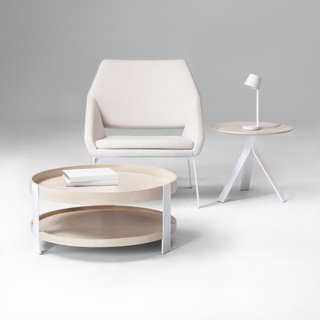 Introducing Dwell x Target - Photo 3 of 3 - Pictured above, Coffee Table, $149.99; Side Table, $89.99; LED Task Lamp, $49.99; Lounge Chair, $249.99. Thinking of "a hybrid between a chair with no arms and a chair with arms," Deam explains, resulted in this lounge seat, which features steel legs and tall, foam-cushioned sides that comfortably cradle the user.
