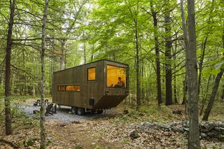 A large window is the focal point of the wheeled dwelling.