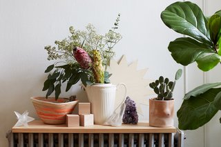 500 Square Feet Is Just Right in Greenpoint - Photo 4 of 6 - One vignette, propped on a radiator, features a pot by Isaac Nichols, a rope basket by Trish Andersen, and a crystal from Sprout Home.