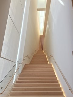Throughout the new space, maple-clad stairs lead visitors to different galleries. Each one is unique and is flooded with natural light that streams through windows from various directions.