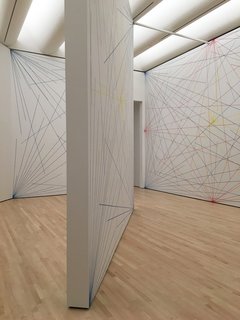 Another experiential room included Sol LeWitt's Wall Drawing 273. Originally imagined by LeWitt in 1975, the intersecting lines were drawn on the walls with graphite and crayon. With a set of instructions on how to apply the design, it was devised to be implemented into any location and to respond to different light and dimensions. Thus, these lines will be painted over when the exhibition ends. 