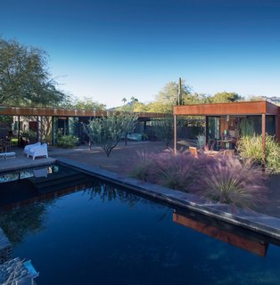Taking it to the Desert With Dwell Home Tours - Photo 6 of 12 - We'll also take you to the Heiny Residence, a midcentury modern house in which the current homeowners have lived in for the last 30 years. Designer Scott Roeder of StudioROEDER reworked the original 1958 design that was composed of two separate masonry structures linked by a series of trellises and gardens. Roeder's goal was to expand the interior space and outdoor gardens while sticking to the confines of the original footprint.
