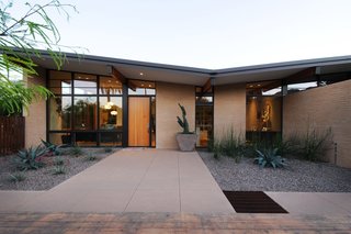 Taking it to the Desert With Dwell Home Tours - Photo 10 of 12 - The Montecito residence—designed by Kristine Woolsey, now of MAYA Design—is yet another home we'll be sharing. Working with a midcentury gem that the homeowners wished to preserve, Woolsey updated it in ways that would make it more functional for a growing family. The first design decision they made was to embrace the existing butterfly roof and turn it into a thematic element.