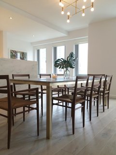 An Icon's Legacy is Revived by a Father-Daughter Bond - Photo 2 of 11 - One of the quintessential Smilow pieces that Judy has reintroduced, is the Rush Dining Chair, originally designed in 1956. Available with or without arms, its structure is crafted of solid walnut and the rush seat is woven in a continuous fashion by experts in Pennsylvania. After discovering that rush weaving has become a dying trade, Judy worked with the SeatWeavers’ Guild in order to find a local producer that still practices the art form. 