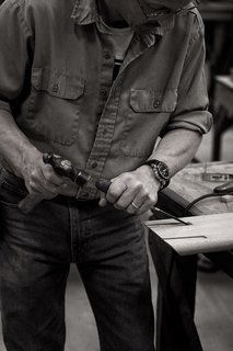 An Icon's Legacy is Revived by a Father-Daughter Bond - Photo 8 of 11 - Taken at the workshop in Lancaster County, this image shows how each piece is carefully produced from start to finish. One of the Smilow craftsmen is shown here making precise notches into a piece of American walnut.