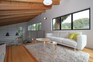 Loewinger points out, "The mezzanine has become the fun room in the house. The kids and their friends regularly hang out up there, without being too separated from the rest of the family." 