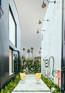 While exploring its extensive outdoor art collection, you’ll find a 25-foot, two-story mural that was the first residential commission by Parisian street artist, Invader. 