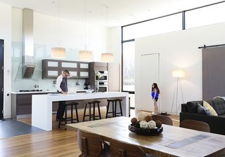 See How Technology Turned This Vacation Home Into a Connected Family Hub - Photo 2 of 5 - Goldstein and his youngest daughter Sari are shown here in the open kitchen that flows into the great room, which has become the main space where the family spends time together. Goldstein explains how integrated smart home technology "allows you to have an intuitive relationship with the architecture." He knew SAGE’s wireless interface could help get the job done. 