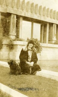 Iconic Perspectives: Frank Lloyd Wright's Hollyhock House - Photo 2 of 13 - Shown here is Aline Barnsdall herself, lounging on the grounds of the Hollyhock House with her dog. The story of the residence could not be told without the powerful presence she held over the project. 