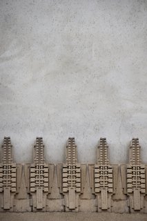 Iconic Perspectives: Frank Lloyd Wright's Hollyhock House - Photo 11 of 13 - The hollyhock motifs lining the exterior of the building were thought to have been created on-site by combining dry natural materials with water into a mold that would then form into the desired shape. The use of clay created the look and feel of concrete that’s clearly influenced by pre-Columbian indigenous architecture. 