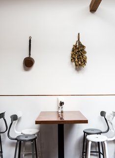 The copper tables are all custom produced by Chris Mast out of the East Bay, who also provided the copper trim in the wall and on the bar.
