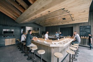 The Classic Hand Roll Bar Makes a Comeback at a New Los Angeles Sushi Spot - Photo 1 of 4 - At KazuNori’s new second location, Marmol Radziner built the U-shaped bar out of bleached eucalyptus wood, while the walls are made of plaster and board-and-batten wood. The sculptural dropped ceiling is constructed of bleached rustic white oak and lined with a warm lighting scheme. 