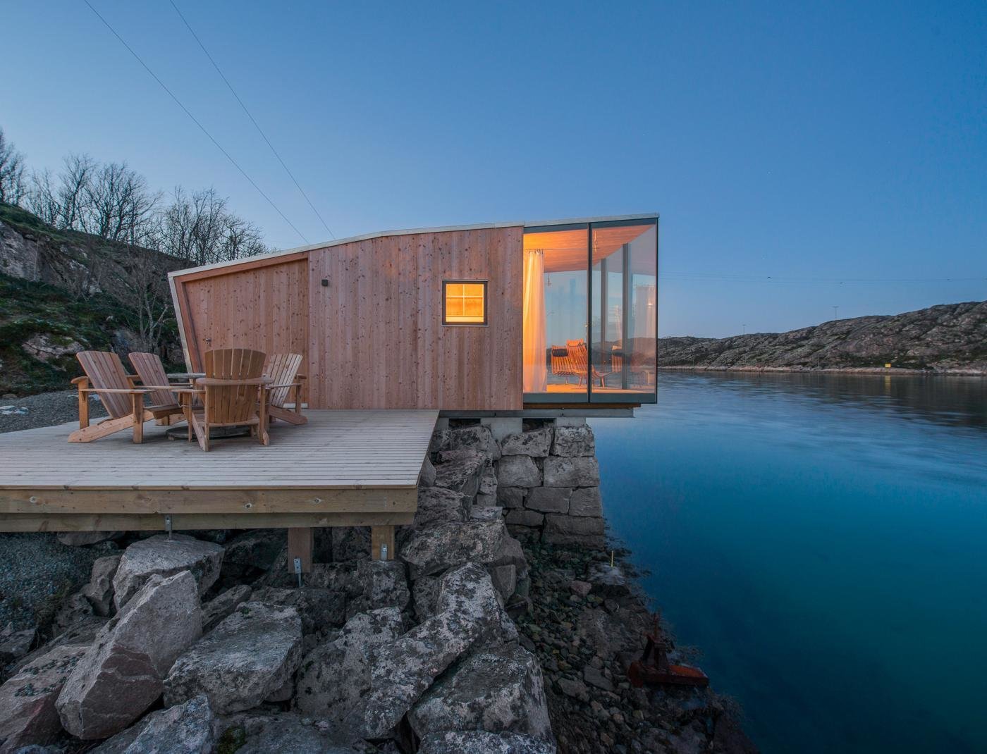 The cabins are made up of two layers of wood construction. The exterior layer is made of Larch wood with a custom glazing.
