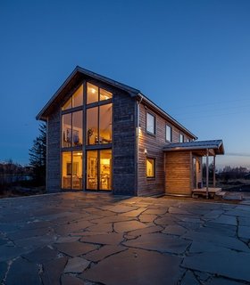 Have You Ever Wanted to Stay in a Norwegian Sea Cabin? - Photo 7 of 8 - Also on the property is the main house that was built in the 1800s. After years of going through renovations, it now consists of a dining area and large open kitchen on the main floor, and a library with a seating area on the second floor. Breakfast is included in your stay and is served here throughout the year, while lunch and dinner is served from April to November.