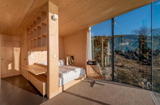 Have You Ever Wanted to Stay in a Norwegian Sea Cabin? - Photo 5 of 8 - Each hut consists of two bedrooms with double beds, a small alcove, bathroom, shower, and small kitchen. Stinessen made sure to provide enough built-in storage for visitors, while also sticking to raw pine surfaces.