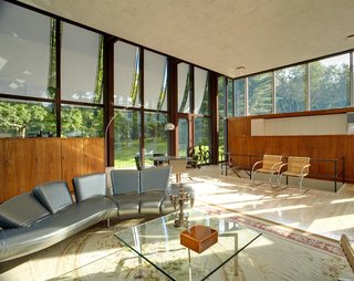 After a Year on the Market, Philip Johnson’s Wiley House Drops by $2 Million - Photo 6 of 9 - Since the large windows had gone through some harsh wear and tear over the years, Ferris decided to replace the old window panels with new double-paned windows while following Johnson’s original drawings. Ferris personally knew Johnson and made sure to stick to his vision when restoring the house. 