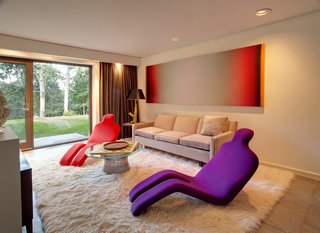 After a Year on the Market, Philip Johnson’s Wiley House Drops by $2 Million - Photo 8 of 9 - Shown here is the sitting room from the bottom half of the main house. As an art collector, the current homeowner has filled the entire interior with bold statement pieces. 