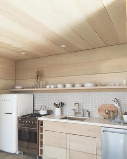 Working Your Way to a Blended Home - Photo 10 of 11 - His backyard fort now has a kitchen and is filled with a ton of cedar and a mix of different calming textures that reflect his beach house-vibe.