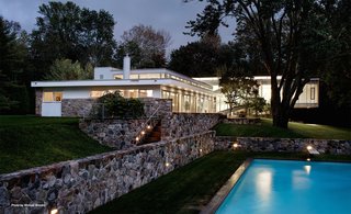 The Breuer property sits on three acres and includes a heated pool, pool house that was originally designed in 1981, sunning deck, and a Mori-designed wine cellar. The terrace features a waterfall and fern garden.