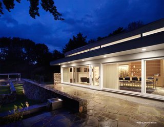 Along with a dining room, living room, and family space, the first floor holds the kitchen, an office, and a powder room. 