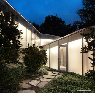 The original Breuer structure is connected to Mori’s addition by a triangulated glass corridor that includes a graduated staircase.